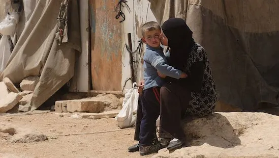 A palestinian woman and her child, https://www.refugeecouncil.org.au/support-israel-gaza-conflict/ palestine-gaza-right-to-health.webp